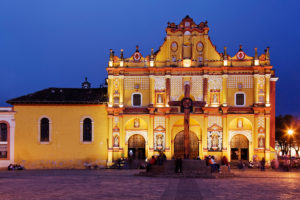 "Cross and ornate church facade in town square, San Cristobal de las Casas, Chiapas, Mexico"